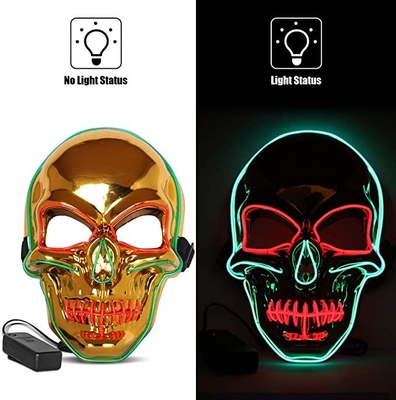 Scheletro spaventoso di Halloween accendere la maschera di protezione piena che emette luce nell'oro scuro degli adulti